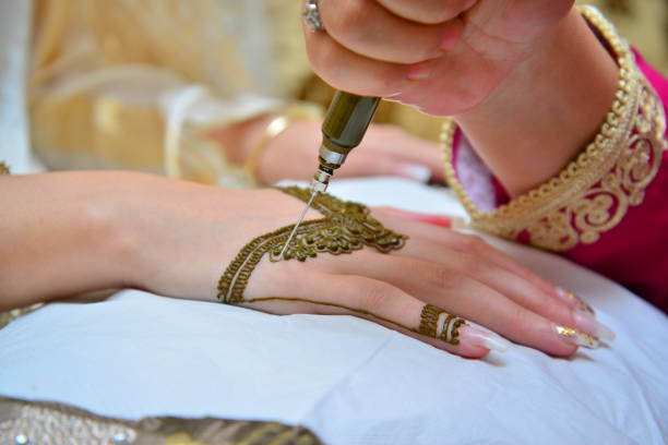 Moroccan woman with traditional henna painted hands